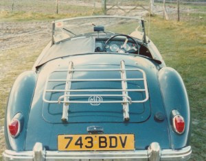 Photograph of the rear view of a blue classic MGA Roadster