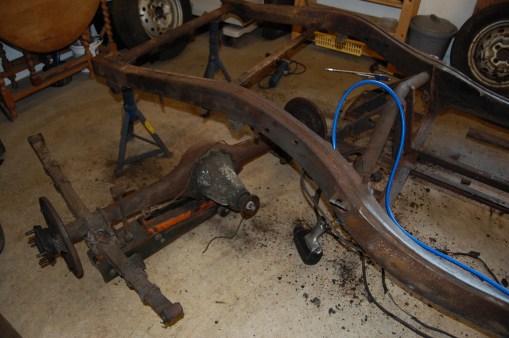 A good air gun is a big help in releasing the various suspension bolts that are unwilling to give up after 55 years. It's much easier to remove the rear springs from the axle once it's removed from the car. Remarkably, I only had to resort to the grinder for one bolt, which was the front left hand spring hanger bolt. All others eventually gave in to copious application of WD40 and grunt.