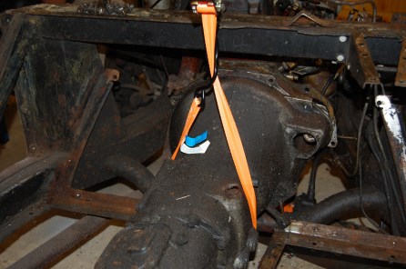 The good thing about this end of the car is that years of oil leaks ensure that most of the bolts are easier to remove. It's essential to maintain lateral support to the gearbox as its released from the bellhousing, otherwise damage can be done to the first motion shaft if allowed to drop or hang from it. The rear gearbox mounting also acted as the rear engine mount. The frame enabled a one-man job, otherwise it definitely requires two.