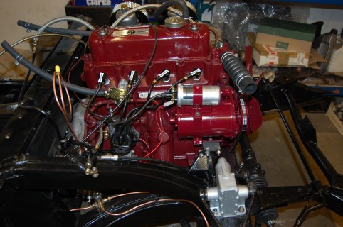 Engine now finished - electronic ignition module fitted in original Lucas distributor, new Lucas coil and Powerlite Dynalite. The Champion plug caps are not original fitment, but during my 41 years of ownership it always had them and I like the look. MGA 1500 engine.