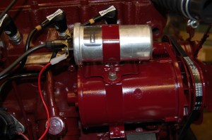 This is the 'Powerlite Dynalite' (alternator) , which they say produces 80% more power and weighs 40% less than the original Lucas unit. It was considerably cheaper than the 'Dynamotor' alternative at £125 purchased through Accuspark, the same unit being sold for in excess of £300 elsewhere. So shop around. The unit is very well made and a straight fit onto the existing mounting brackets, also taking the coil mounting collar and utilising the original fan and pulley. MGA 1500 alternator.