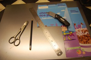 Preparing to make the chassis repair section. First a cardboard template - cereal boxes are the perfect weight of card.