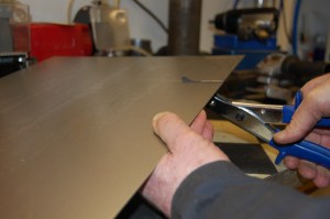 I used a nibbler as I don't have a guillotine - 14 guage is about the max for a nibbler and hard work on the wrist.