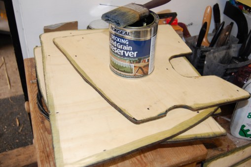 Floor edges treated with decking end grain preserver before painting with Sadolin black wood stain.