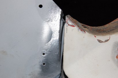 On both sides the door to scuttle gap was too wide and needed closing. The only credible way is to do as the factory did and lead load it. This shot shows the original factory leadwork.