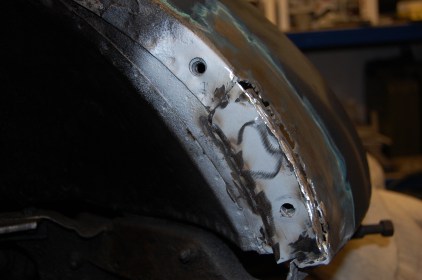 Welds ground back and flange beaten into a lower profile to allow build up of lead load.