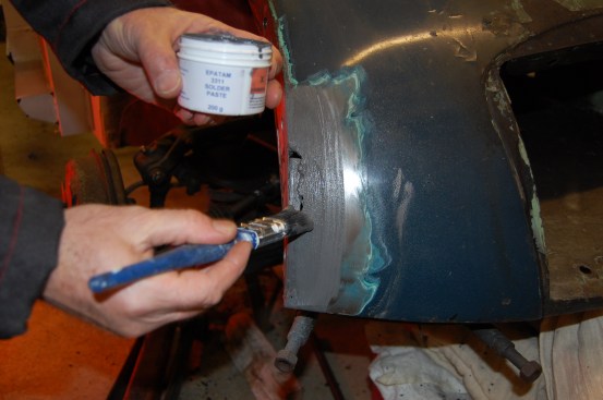 Having cleaned the area back to bare metal, solder paste is brushed on to the bit to be leaded.