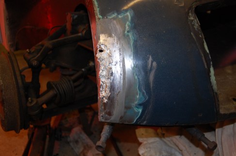 The lead bar is then heated and blobs of pasty solder dropped roughly across the repair zone.