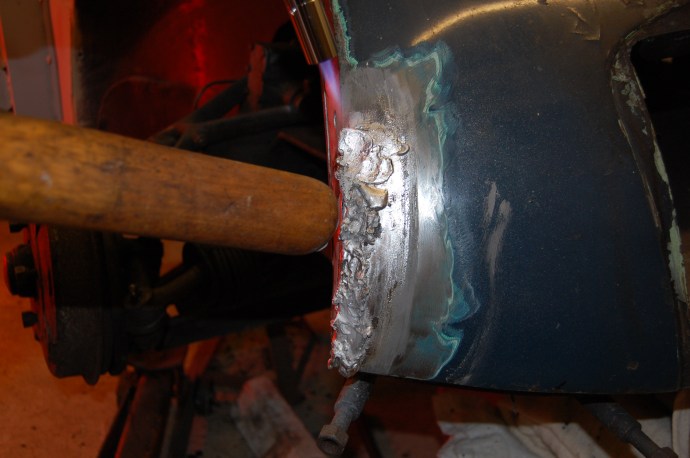 Now for the next stage of working the lead down to a smooth surface using the hardwood paddle, that has been well lubricated with tallow to stop it sticking to the hot lead.