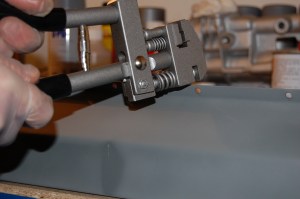 All repair panels were dismantled and metal primed, using either weld-thru, etch or zinc depending on area primed. Edges to be welded were prepared using joddler/punch. Holes were punched every few inches ready for plug welding. The joddler tool was not cheap but is a great asset.