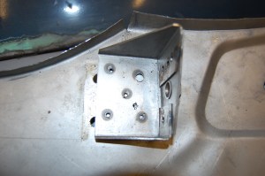 This is the chassis mounting bracket for the B post backing/inner panel which is incorrectly located. The repair section is impossible to fit without removing the bracket, dry fitting the repair section and then sizing up the bracket against the panel, having bolted it to the chassis.