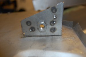 Having refitted the bracket to the panel and trial fitted, I found that the captive not was also fitted about 1cm too far into the bracket. When fitted to the chassis, this had the effect of distorting the panel and pulling the lower section tight to the chassis rail. This led to the bracket having to be dismantled by drilling out the spot welds and then repositioning the captive nut.