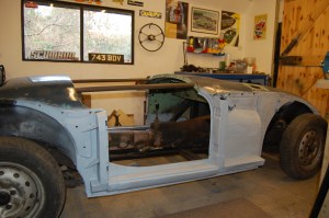 Work restarted in January 2014. Car back on it's wheels after final work on structural bodywork. Cockpit braced ready for removal of body. Some say this is unnecessary if inner and outer sills are in good shape, but I prefer belt and braces approach given the hours spent on trying to get it all right.