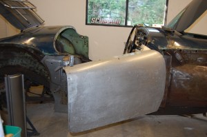 Trial fitting of door to original door pillar, to aid alignment and positioning of new repair sections, particularly the 'B' post. This is critical if panel fit and shut lines are to be perfect.