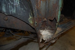 Serious corrosion caused by years of water running down inside the 'B'pillar and road dirt thrown up inside rear wheel arch.