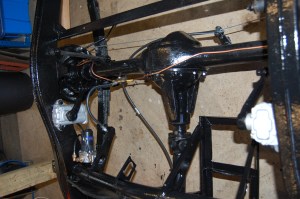 Right hand battery cradle removed apart from the arm that retains and supports the flexible brake hose, as the left hand cradle will be used for a single 12 volt battery in place of the original two 6 volt. The left hand cradle is used in order to balance the weight in a right-hand drive car. Not sure it makes much difference, but seemed sensible advice. MGA 1500