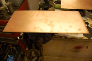 Some restorers suggest fitting a heat shield between the passenger side (RHD) floorboards and the exhaust pipe. I had no plan to do so as it was never a standard fit, but I came across a few sheets of this redundant circuit board insulation - thin copper sheets sandwiching a layer of fibreglass and decided it had to be used. MGA 1500 heatshield.